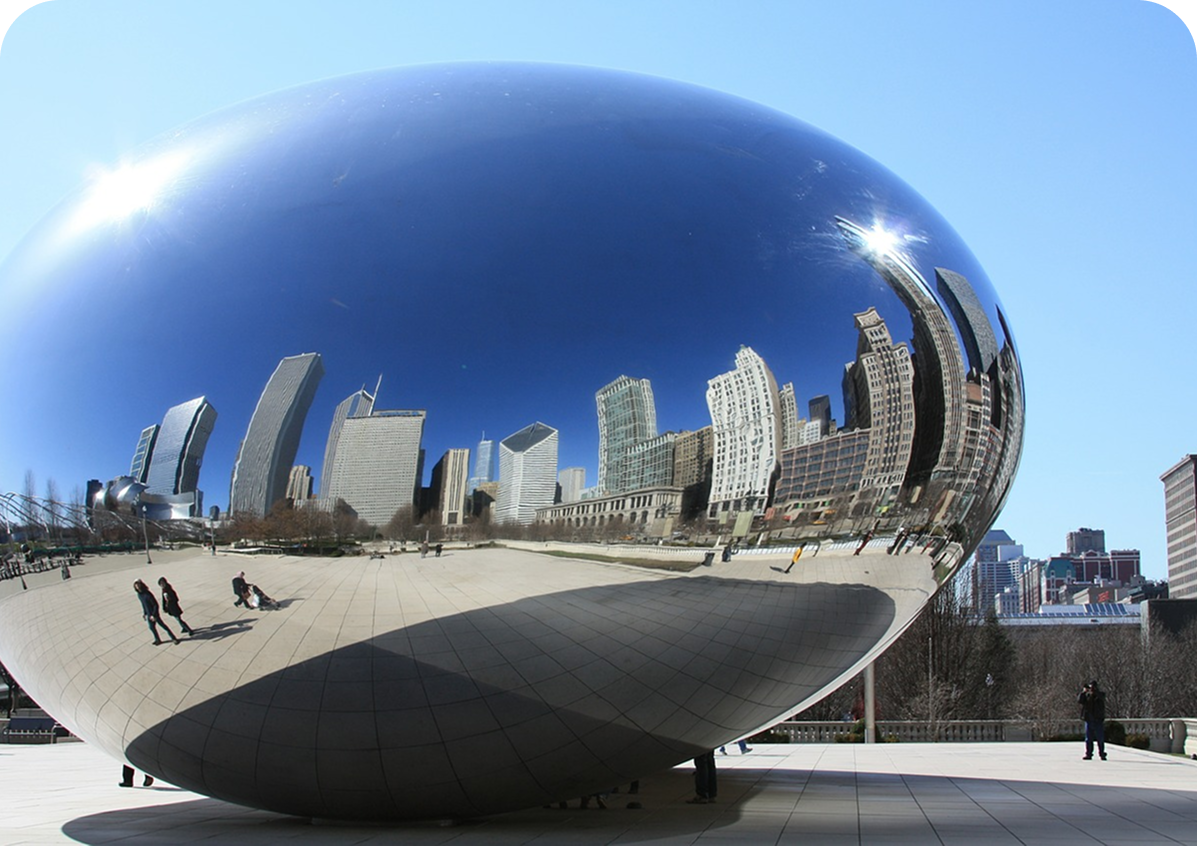Reflective sculpture with city skyline